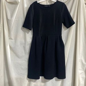 Beautiful thick black dress. Can be dressed up to really formal or dressed down